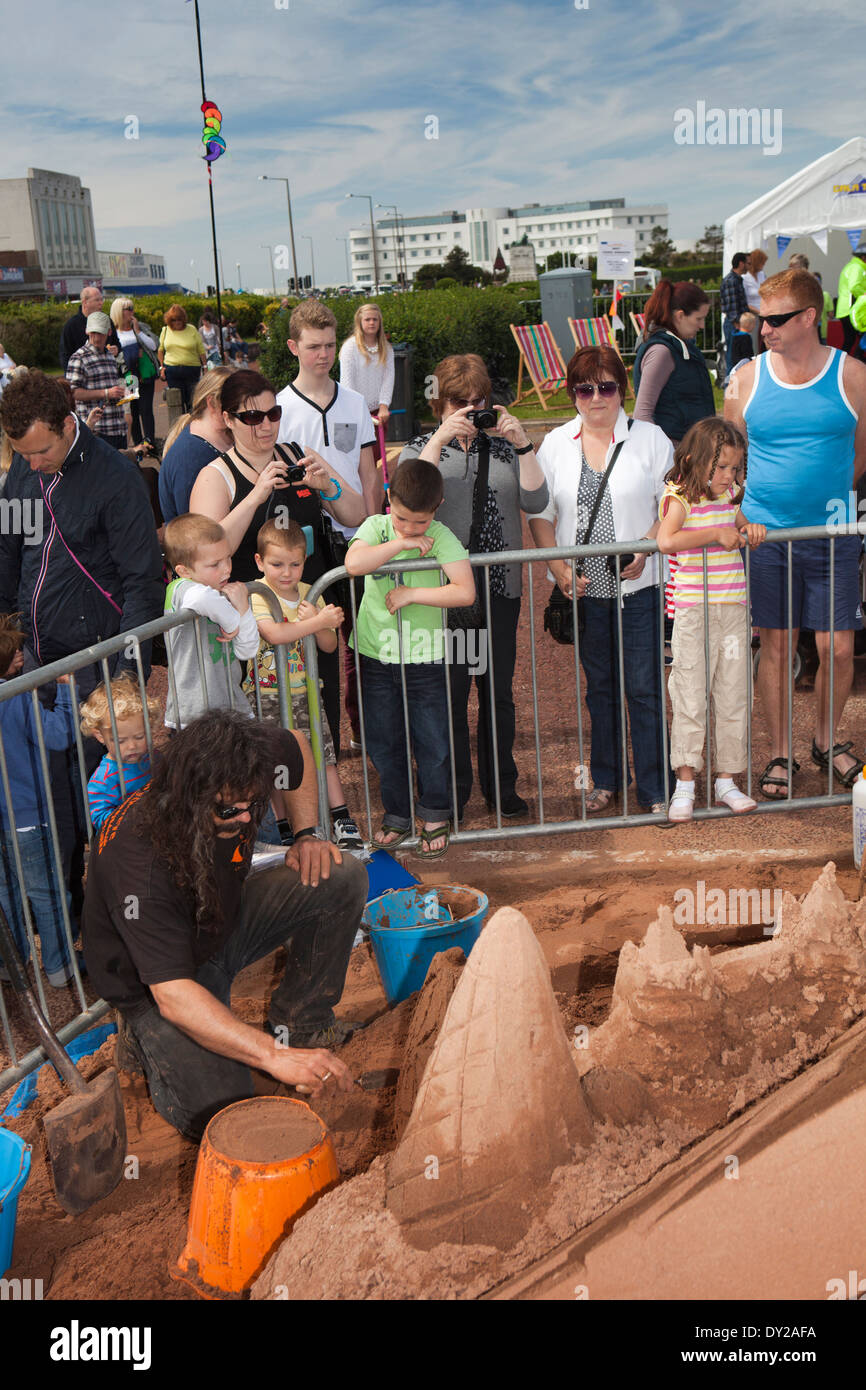 UK, England, Lancashire, Morecambe, Sandcastle Festival professional sand carver Andy Moss at work Stock Photo