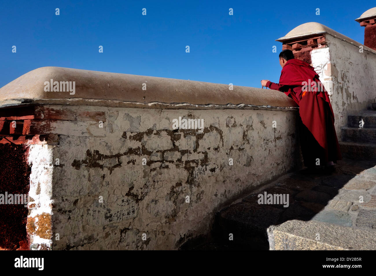 Buddhist monk on stairs to Patola Palace Lhasa,Candid street photography,Life of Buddhist devotion Stock Photo