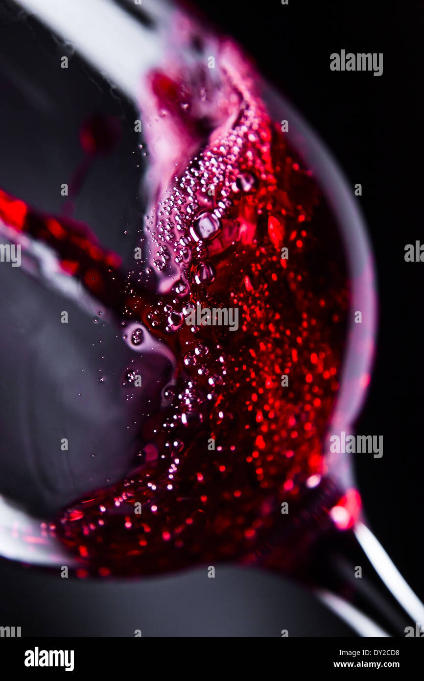 Red wine in wineglass on black background Stock Photo