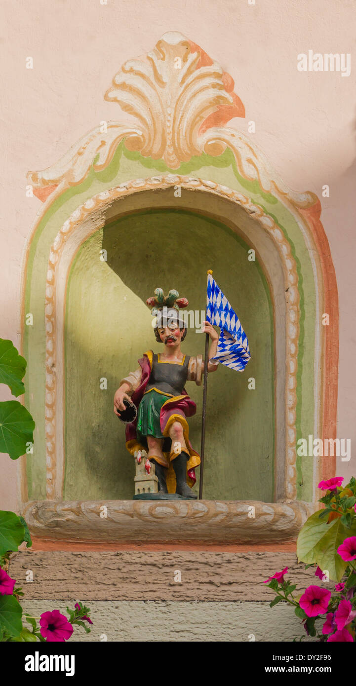 Statue to Saint Florian in a niche, Oberammergau, Bavaria, Germany. Stock Photo