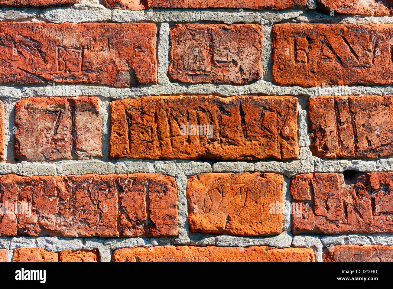 Inscriptions on a brick wall Stock Photo