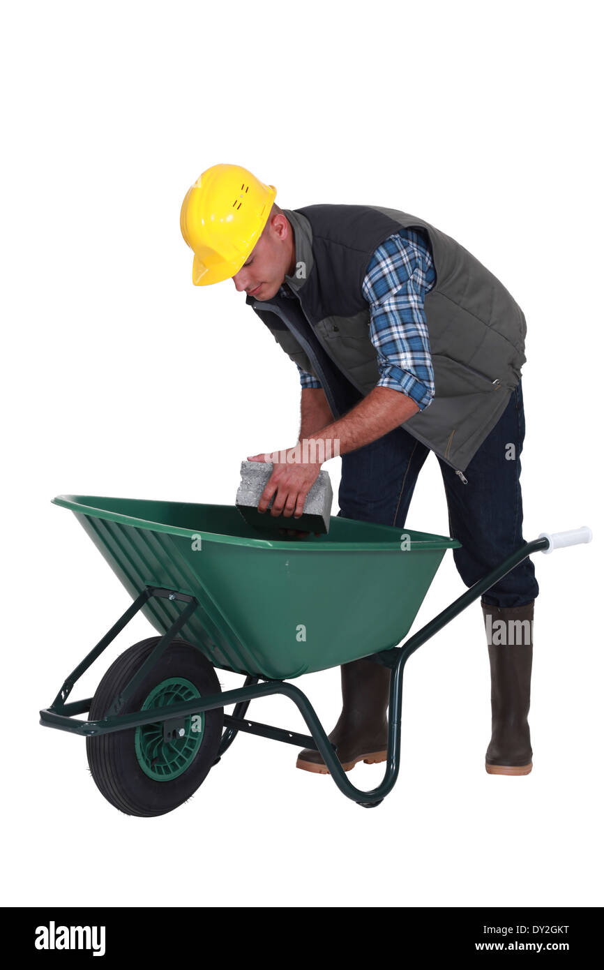 Builder with a wheelbarrow Stock Photo Alamy