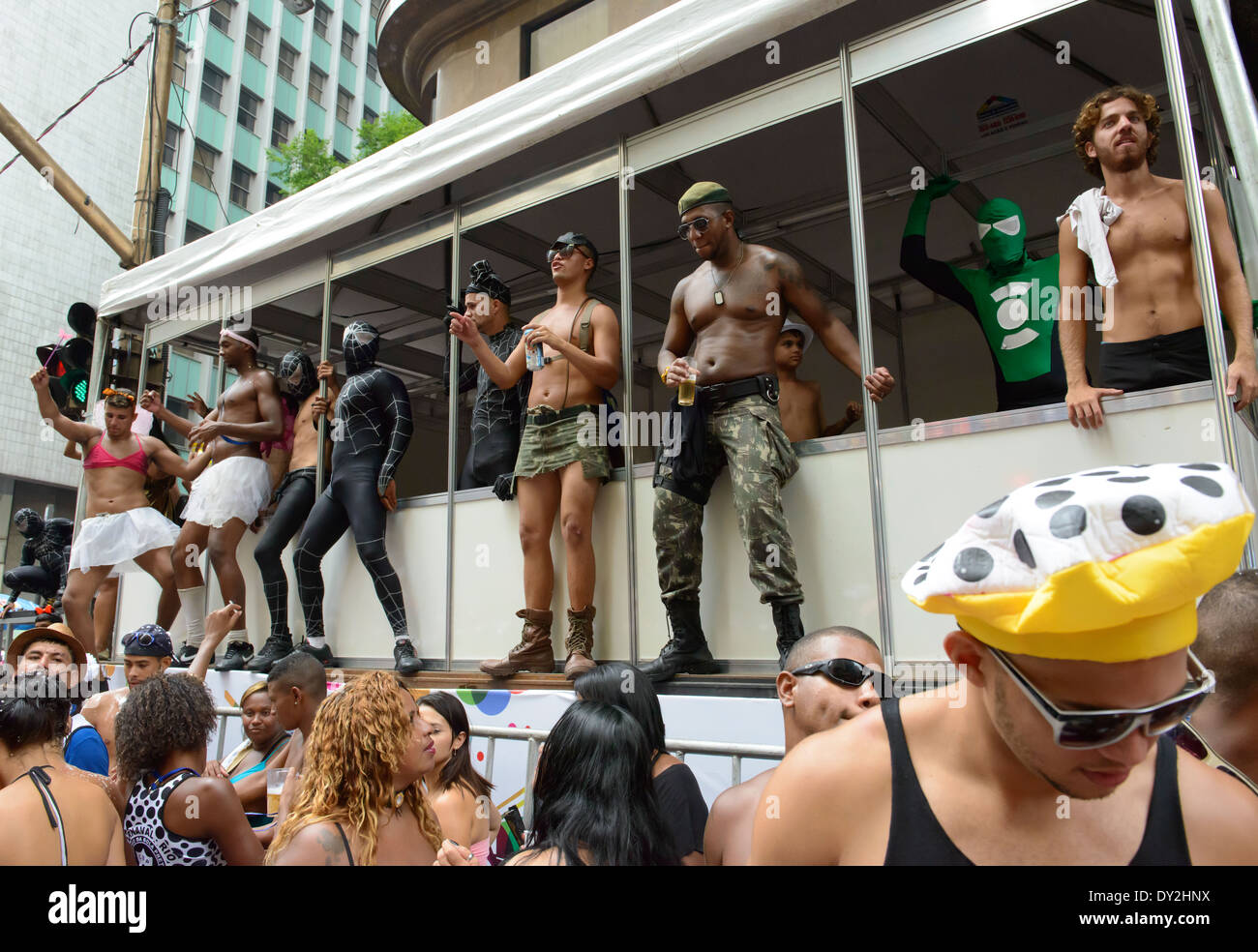 Crowds and crazy costumes on float at street party (bloco), downtown Rio de Janeiro during 2014 Carnival Stock Photo