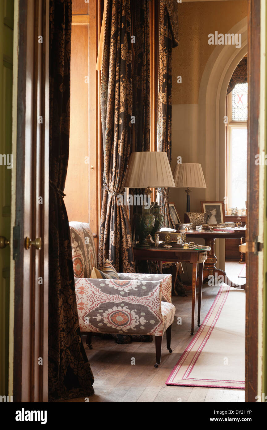 An Armchair Covered In Bukhara In Nutmeg By Lewis And Wood In Morning Stock Photo Alamy