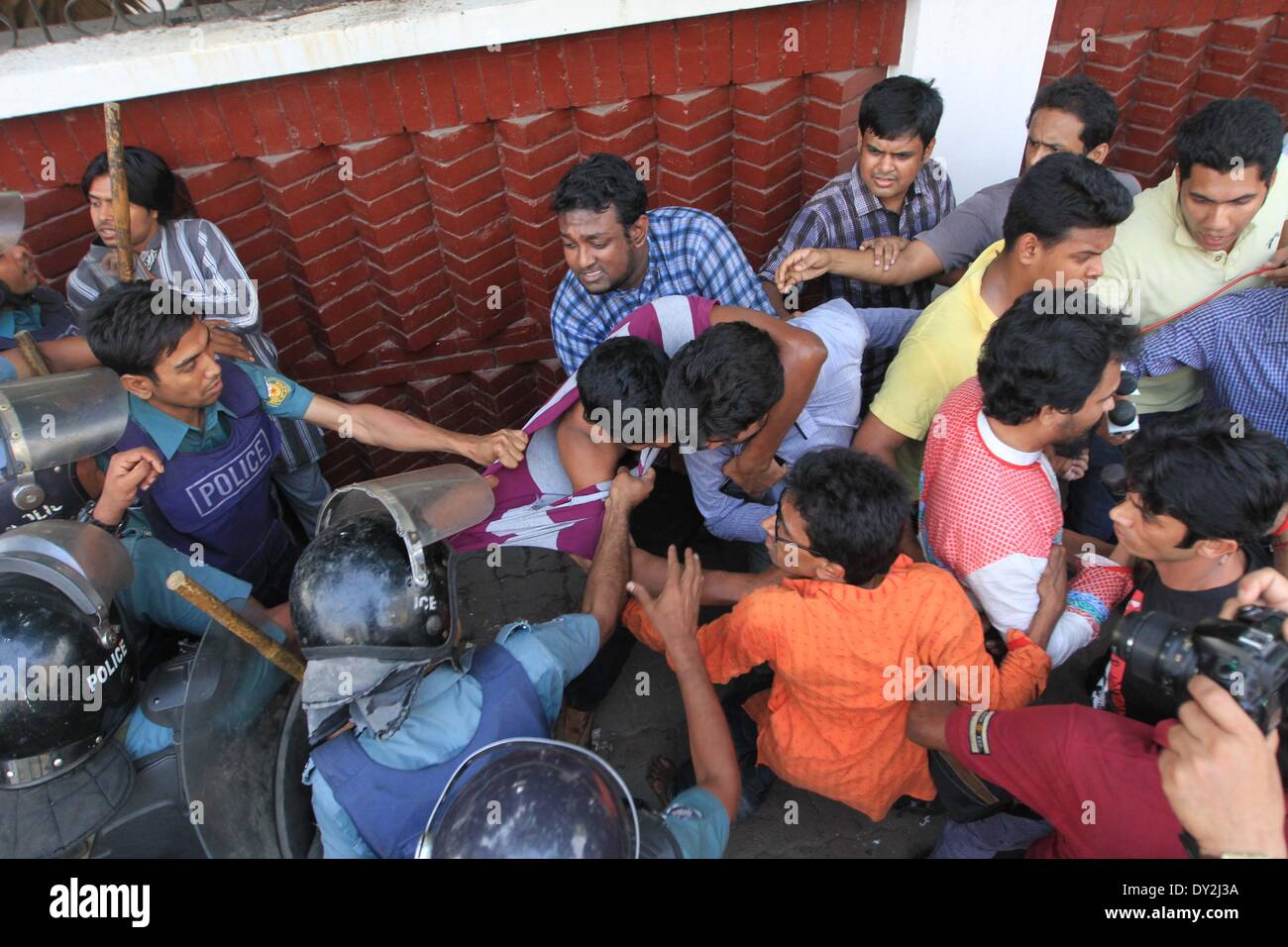 Dhaka, Bangladesh. 4th April 2014. Ganajagaran activists have been baton charged by police on Friday at Shahbagh intersection in Dhaka,  as the organization tired to hold a rally at the place. Stock Photo