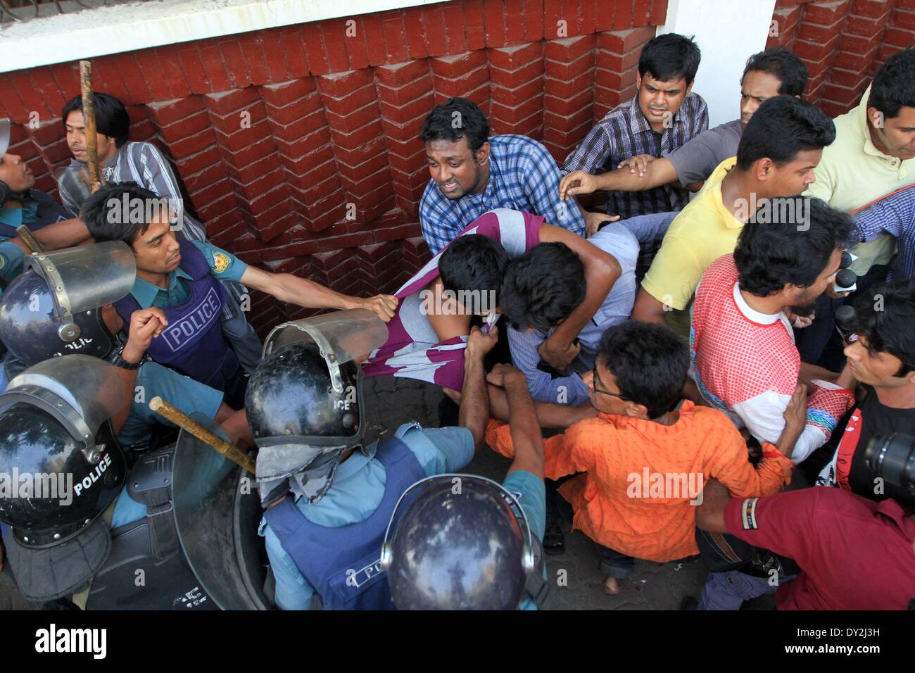 Dhaka, Bangladesh. 4th April 2014. Ganajagaran activists have been baton charged by police on Friday at Shahbagh intersection in Dhaka,  as the organization tired to hold a rally at the place. Stock Photo