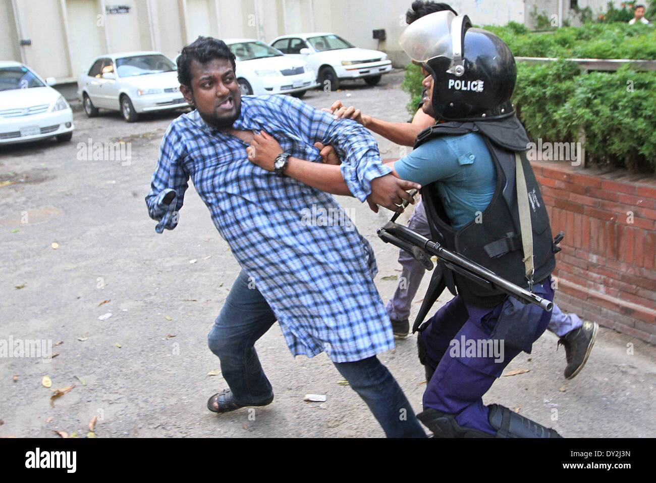 Dhaka, Bangladesh. 4th April 2014. Ganajagaran activists have been baton charged by police on Friday at Shahbagh intersection in Dhaka,  as the organization tired to hold a rally at the place. Stock Photo