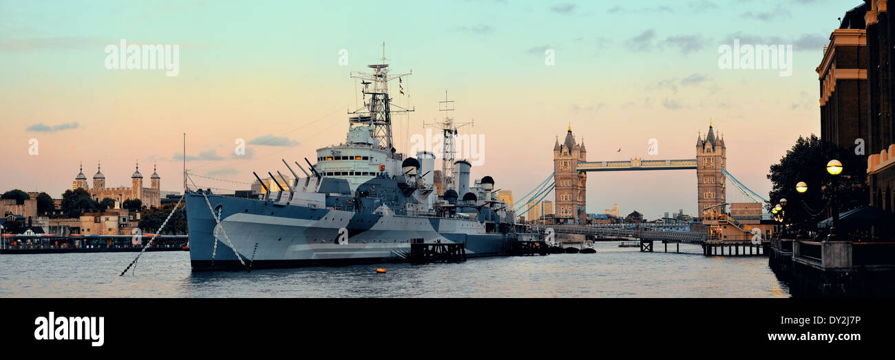 HMS Belfast warship and Tower Bridge in Thames River in London Stock Photo