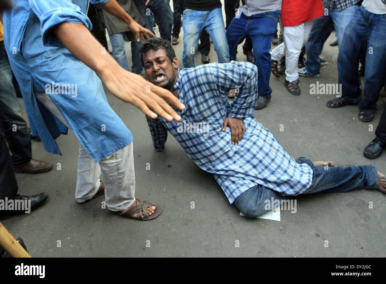 Dhaka, Bangladesh. 4th April 2014. Ganajagaran activists have been baton charged by police on Friday at Shahbagh intersection in Dhaka,  as the organization tired to hold a rally at the place. Stock Photo