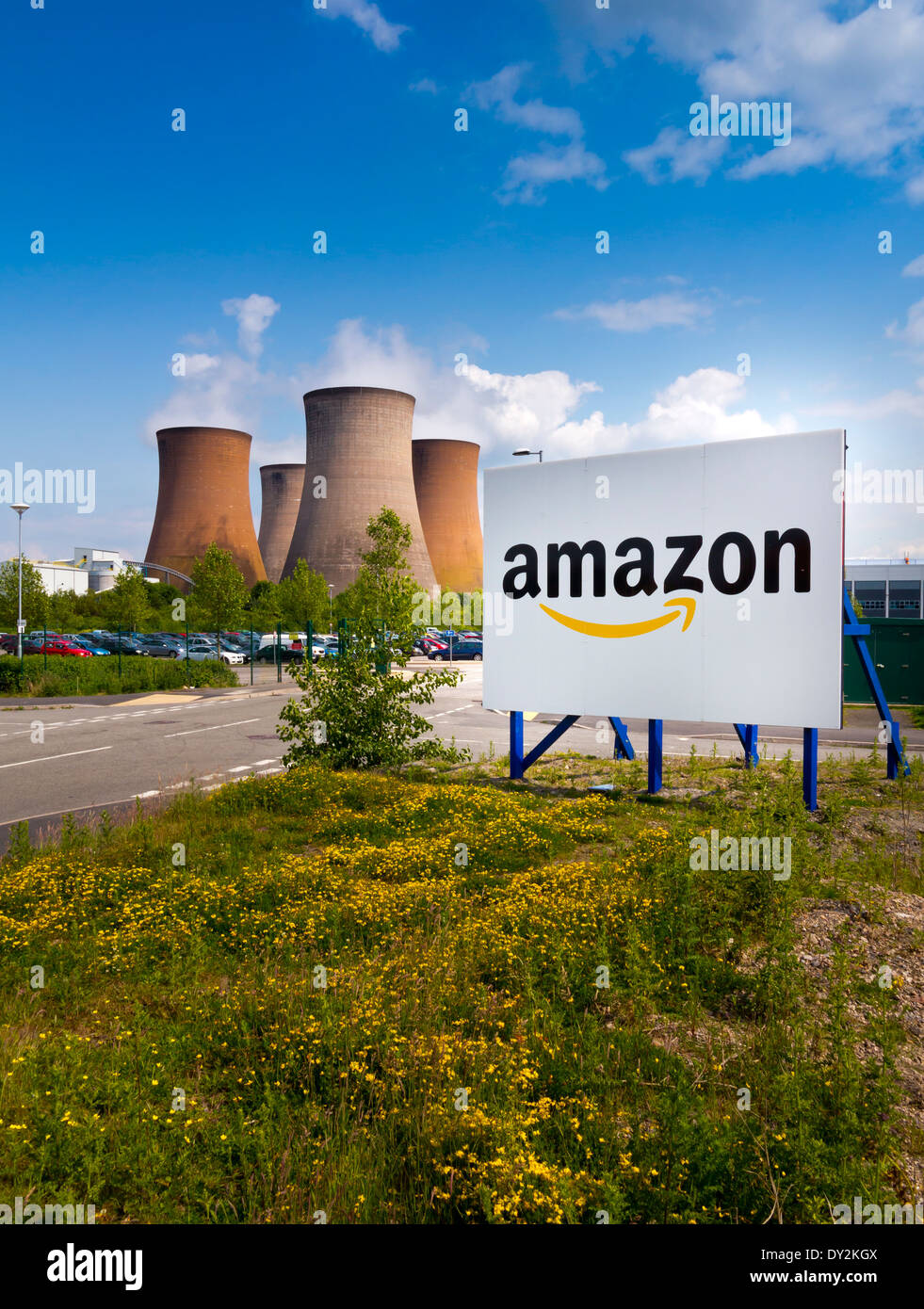 Sign outside the entrance to  Amazon UK warehouse in Rugeley Staffordshire next to cooling towers of coal fired power station Stock Photo