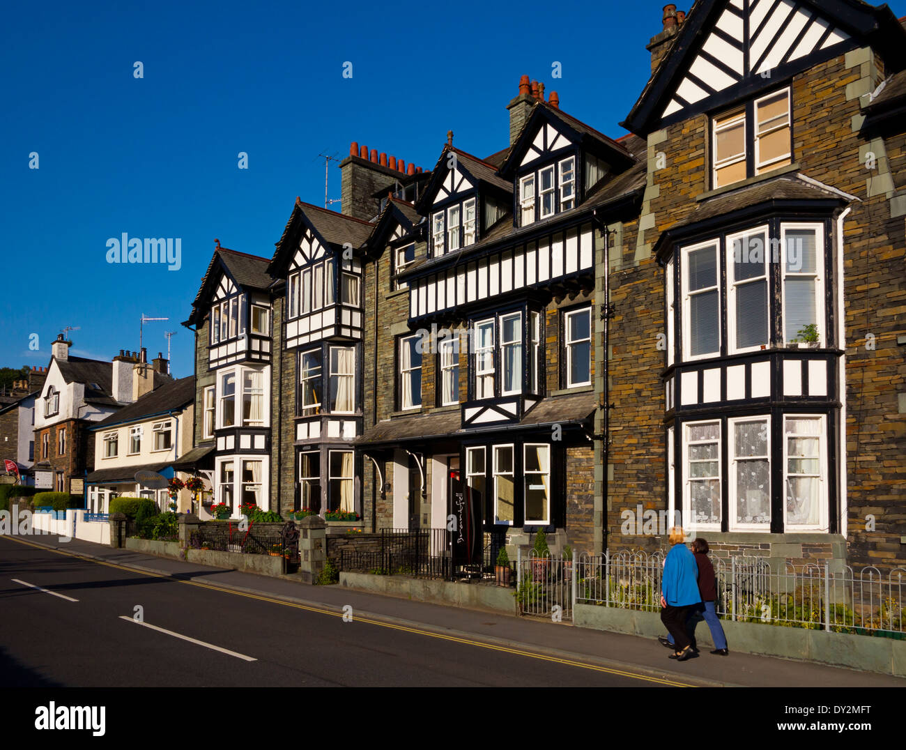 Houses and hotels on a street in Ambleside in Cumbria a small town in the Lake District National Park next to Lake Windermere Stock Photo