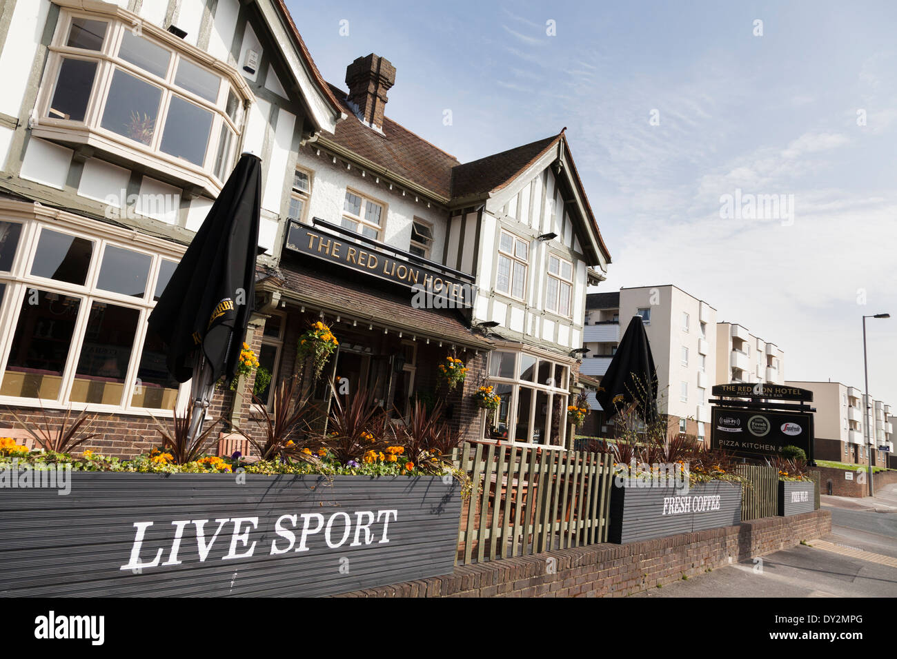 Pub exterior advertising 'live sport', 'Fresh Coffee' and 'free Wi-Fi' to attract customers. Stock Photo