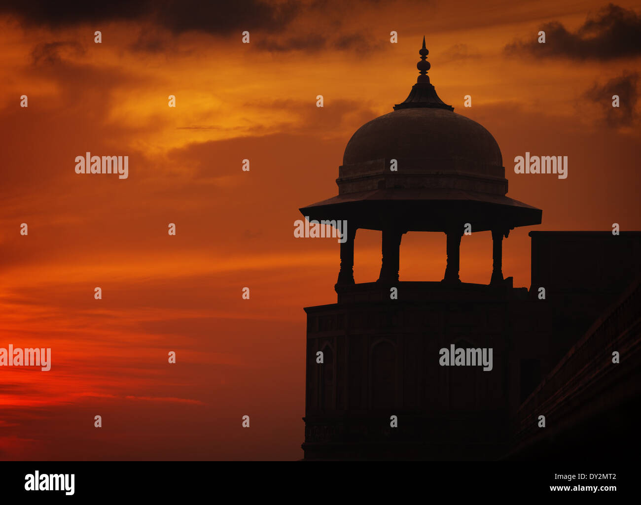 Silhouette of Asian style tower on sunset sky background, Red ford, Agra, India Stock Photo
