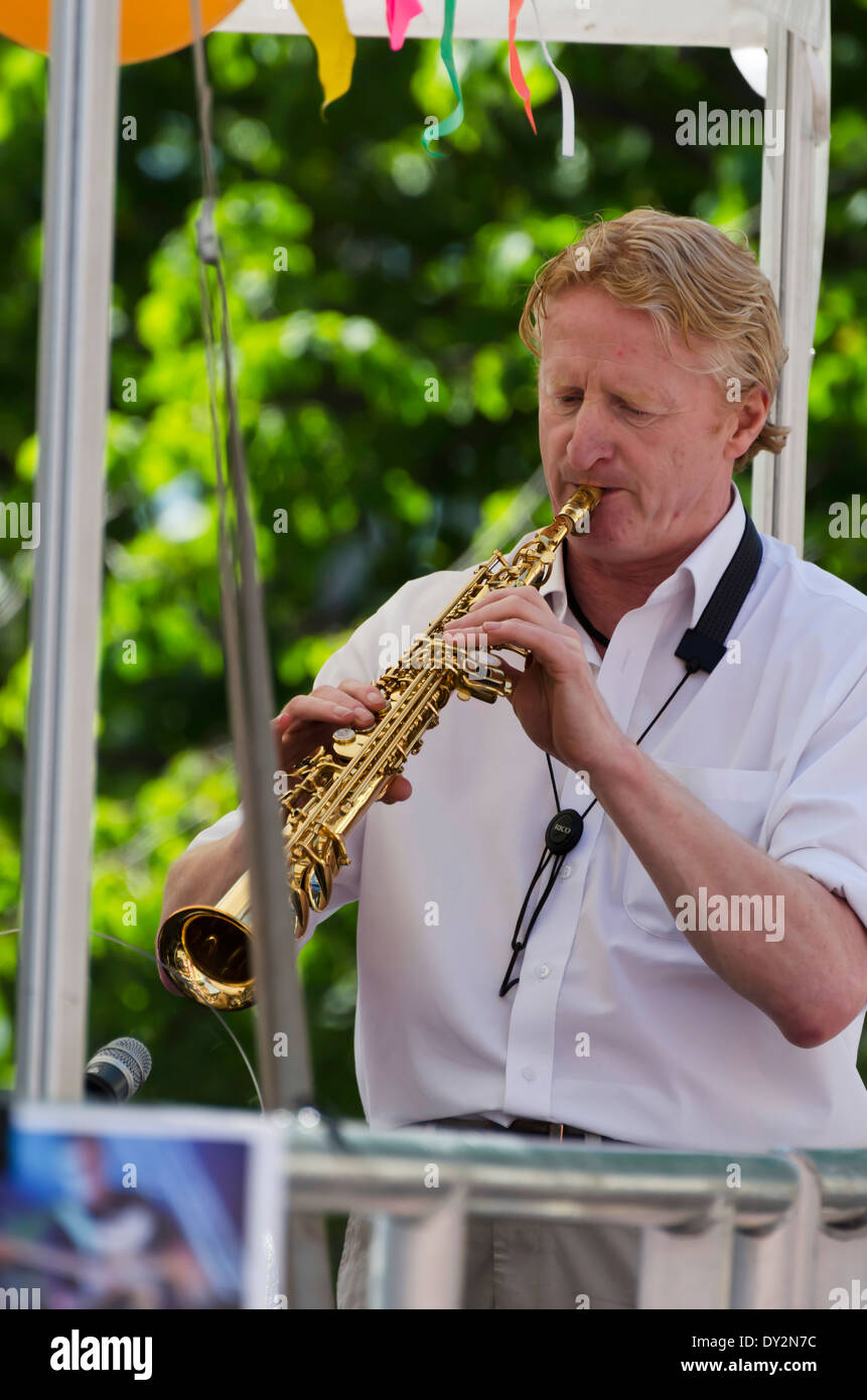 "Lights Out by Nine" sax player performing at the Mardi Gras, part of
