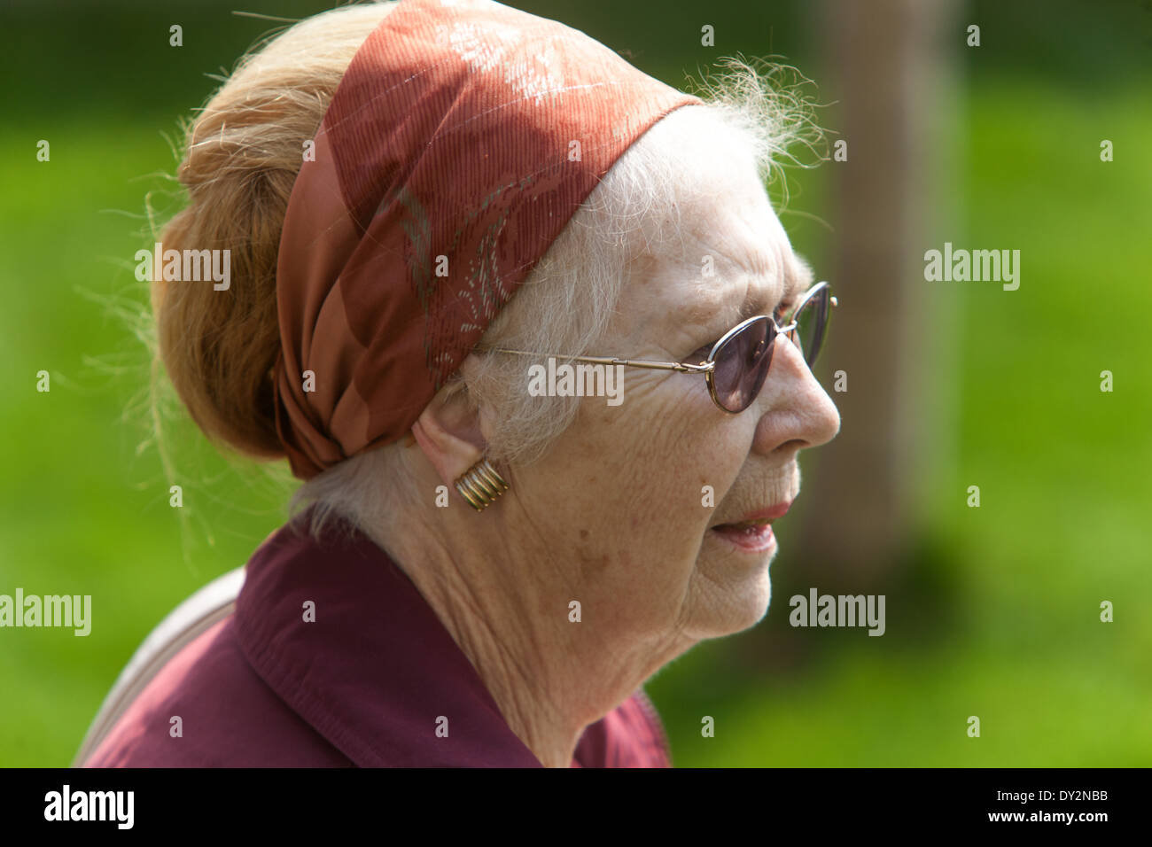 Elderly woman headscarf Senior woman, Face side view Stock Photo