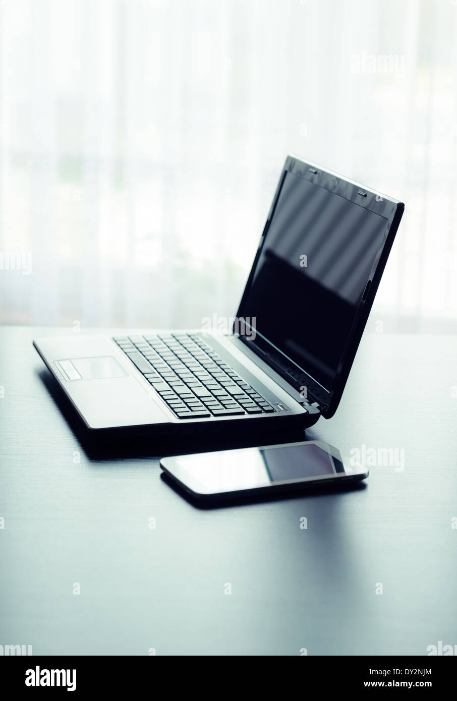 Modern laptop and tablet in office Stock Photo