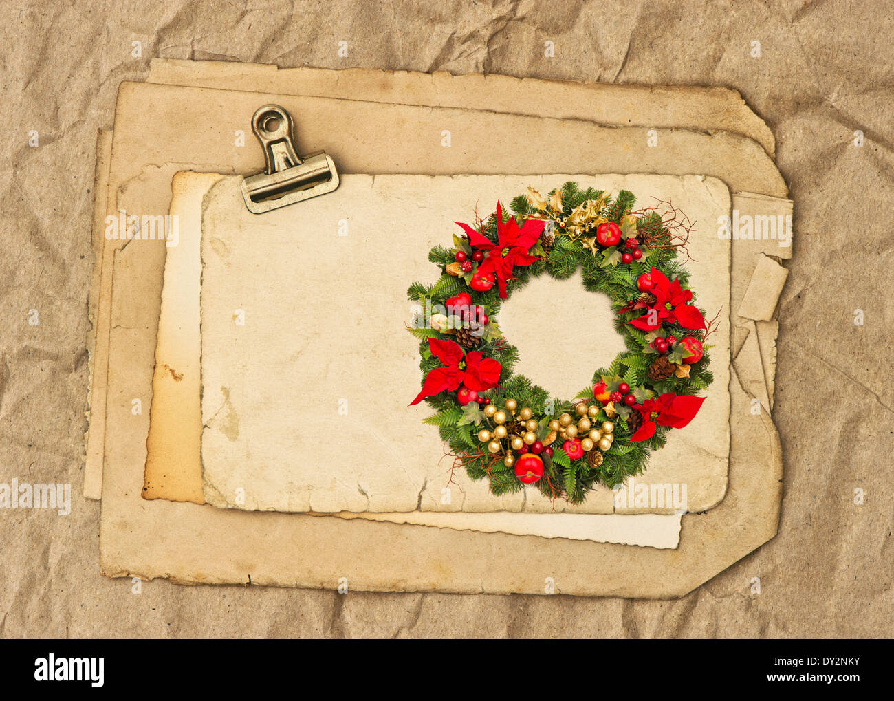 old blank paper and photo sheets with clip and christmas wearth picture. nostalgic background Stock Photo