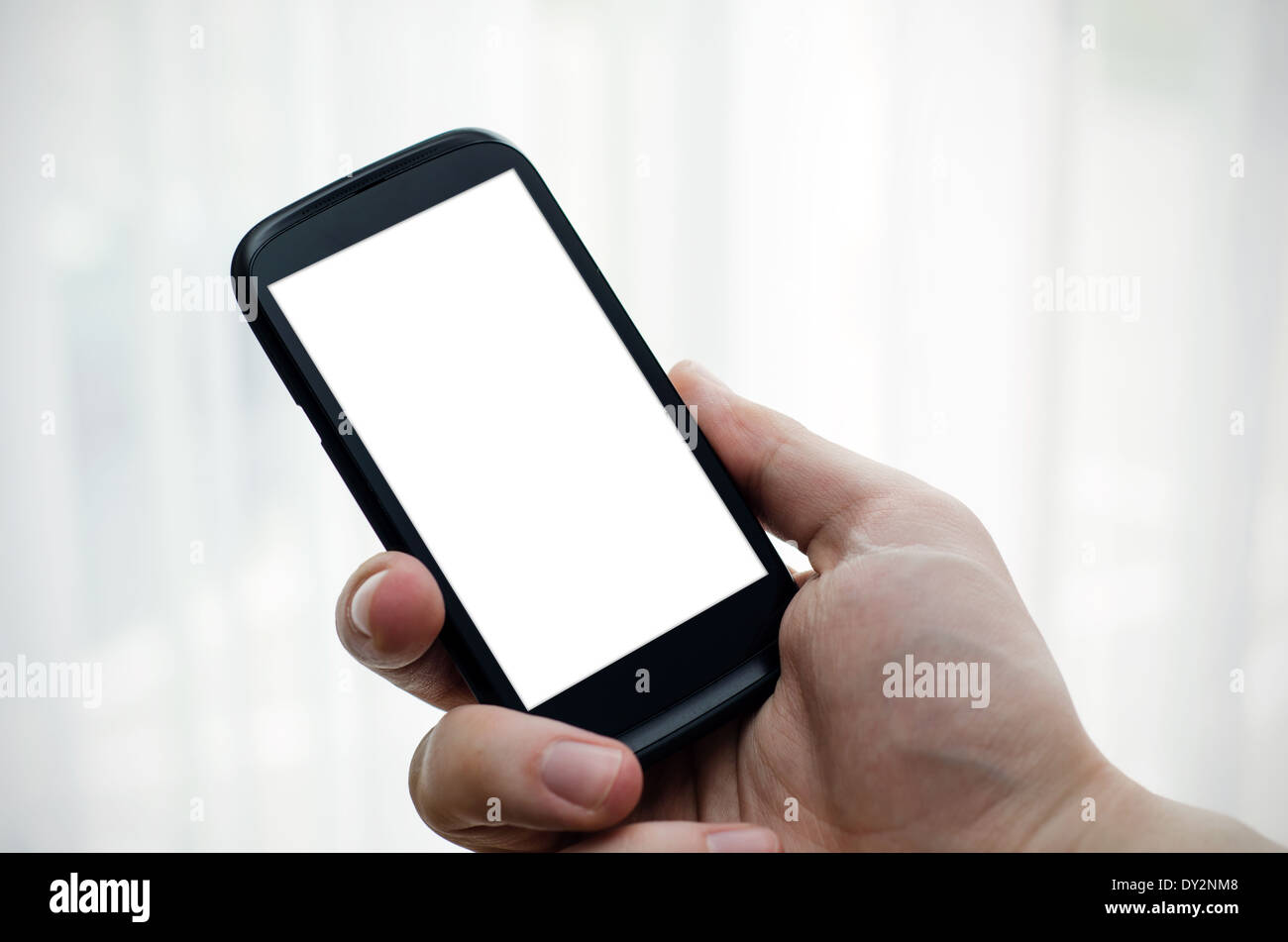 Hand holding mobile phone with blank display Stock Photo