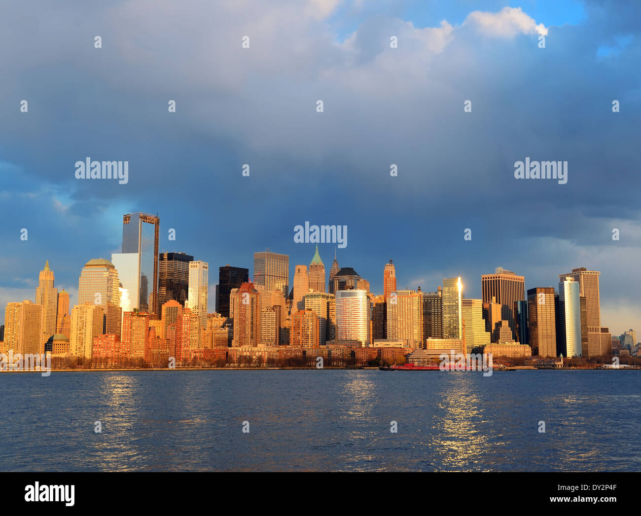 Downtown Manhattan skyline at sunset over Hudson River in New York City ...