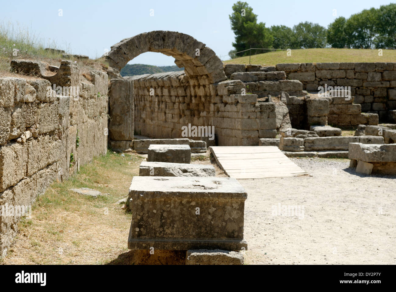 Stone bases Zanes leading to Olympic stadium entrance Ancient Olympia Peloponnese Greece Zanes