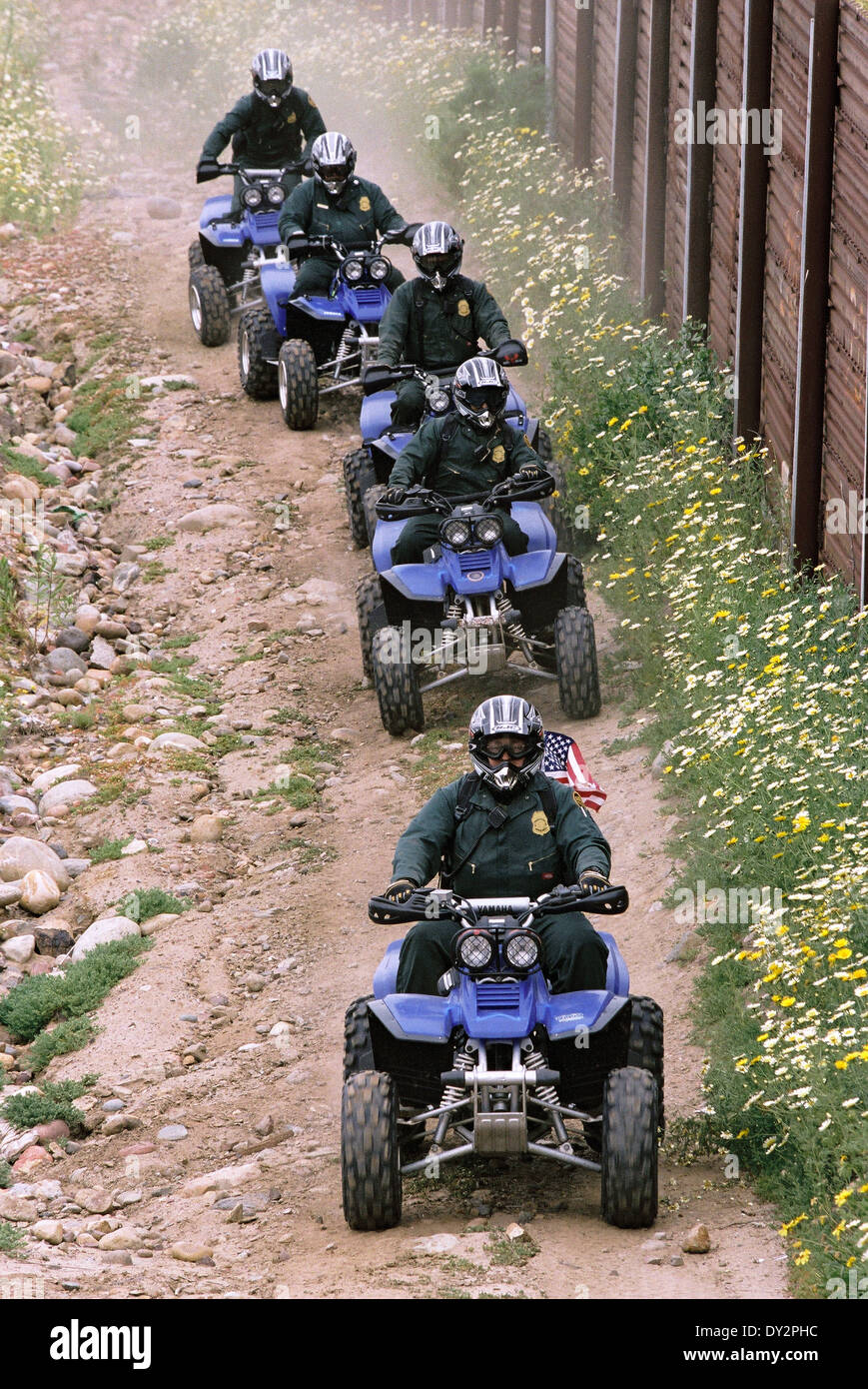 US Border Patrol officers use of ATV's to patrol along the border fence with Mexico June 1, 2006