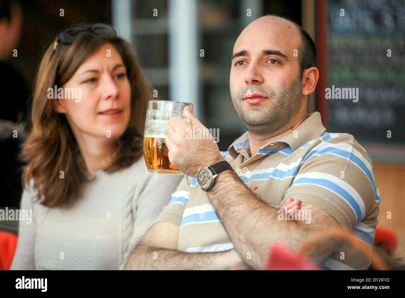 Tourists, man drinking Czech beer, Prague Czech Republic Stock Photo