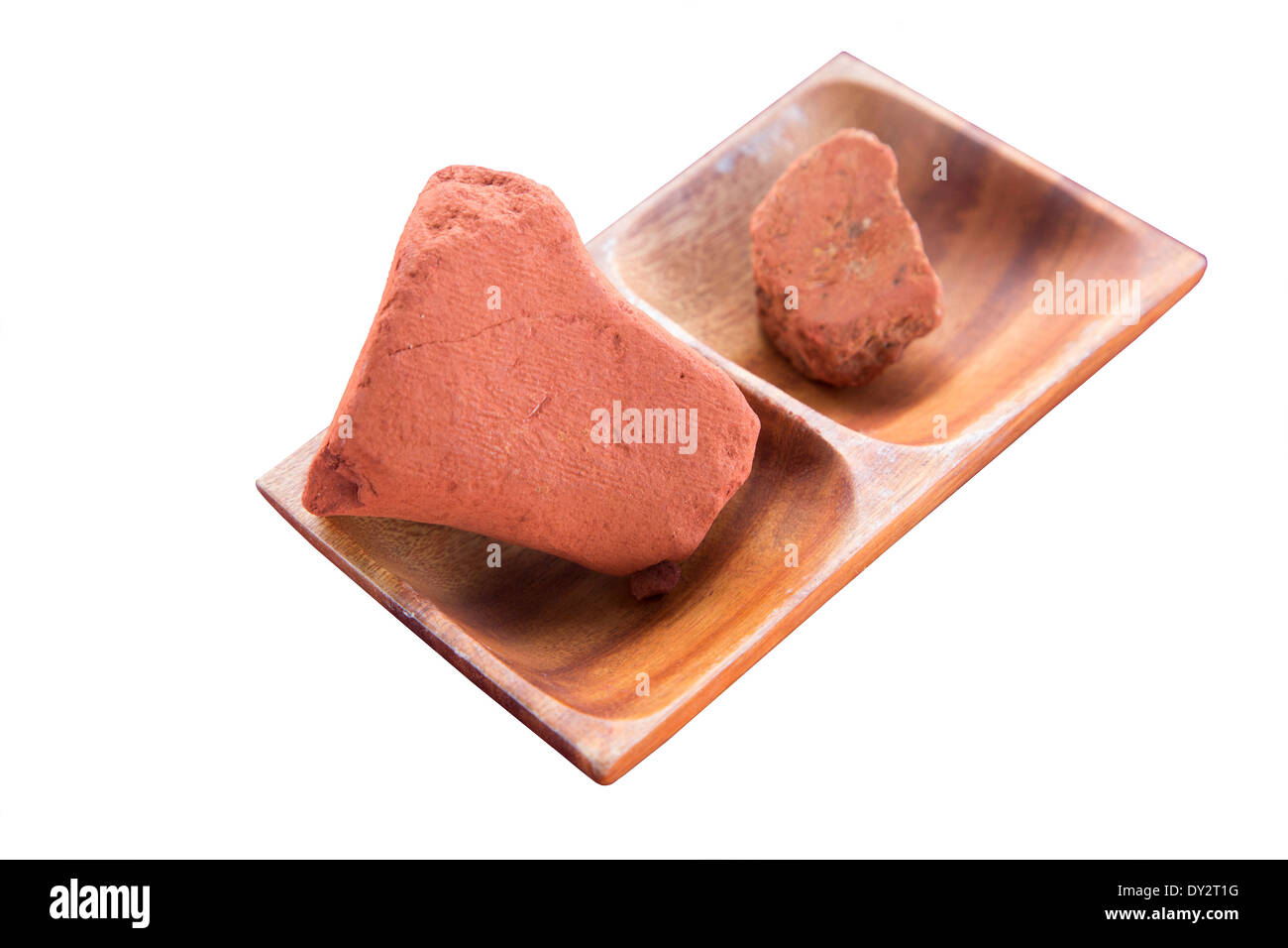 Alae, Kauai red clay containing iron oxide, used for color during the  traditional Hawaiian method of harvesting sea salt, in wood tray Stock  Photo - Alamy