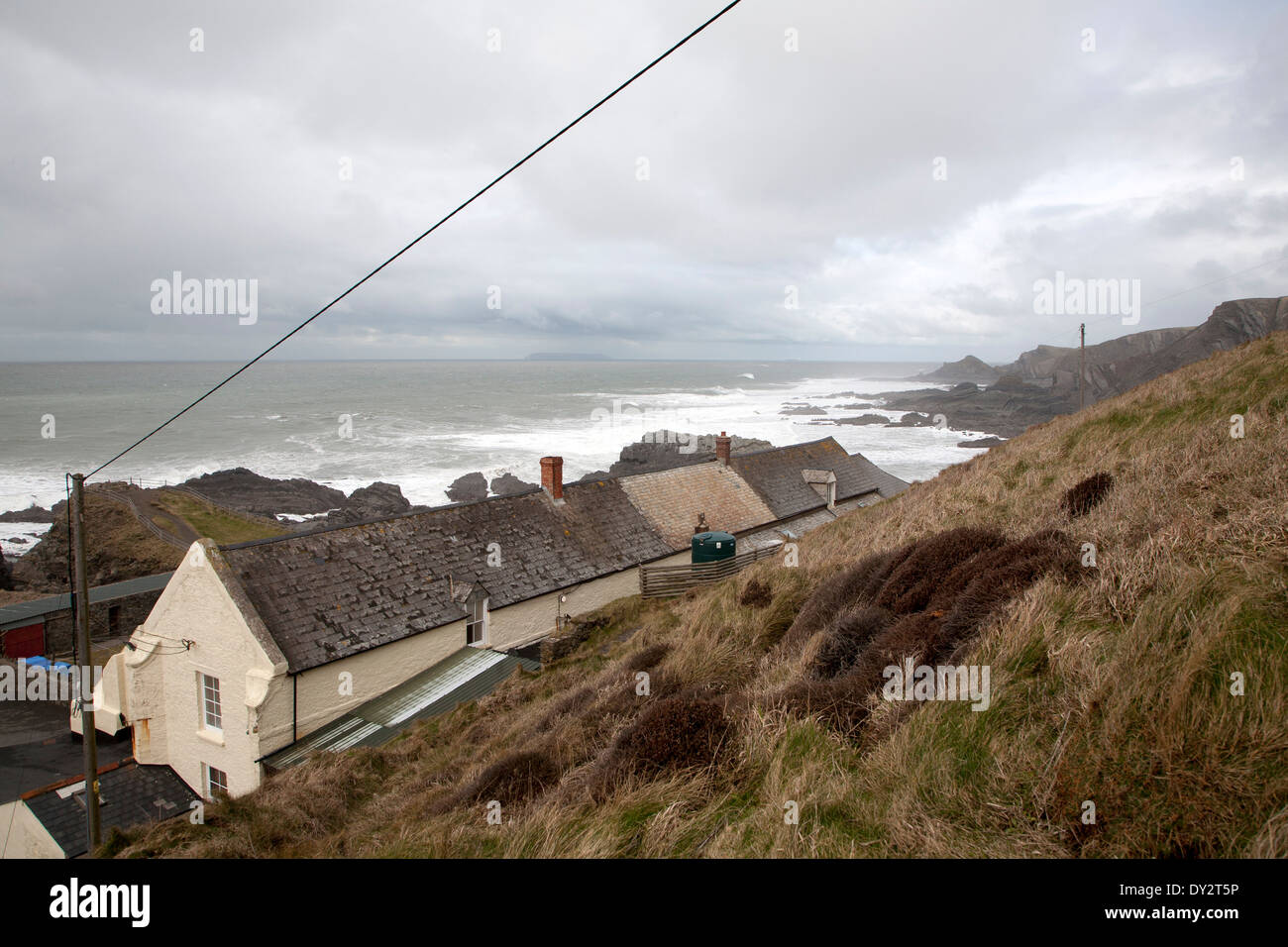Hotel buildings and stormy sea, Hartland Quay, north Devon coast, England Stock Photo