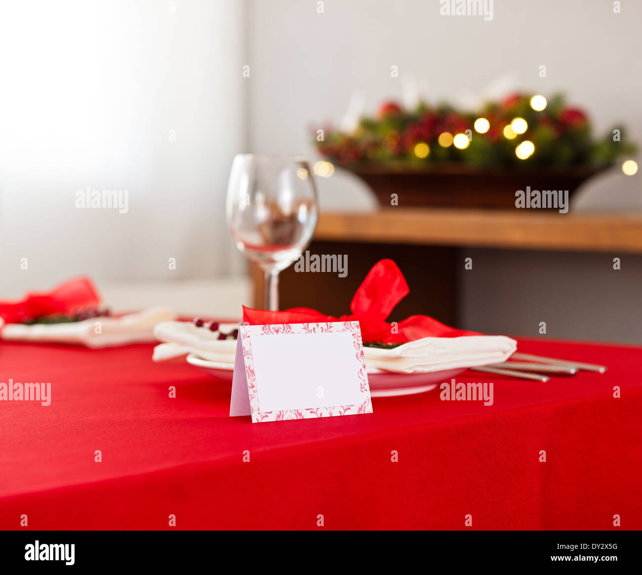 Christmas dinner table setting with name card in red Stock Photo Alamy