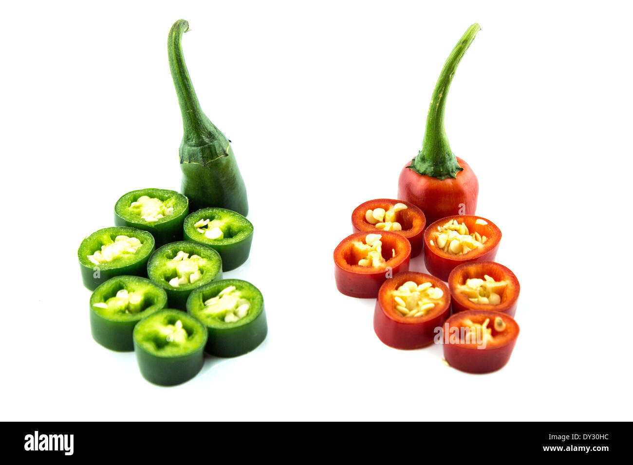 red and green hot chili pepper slices on a white background Stock Photo