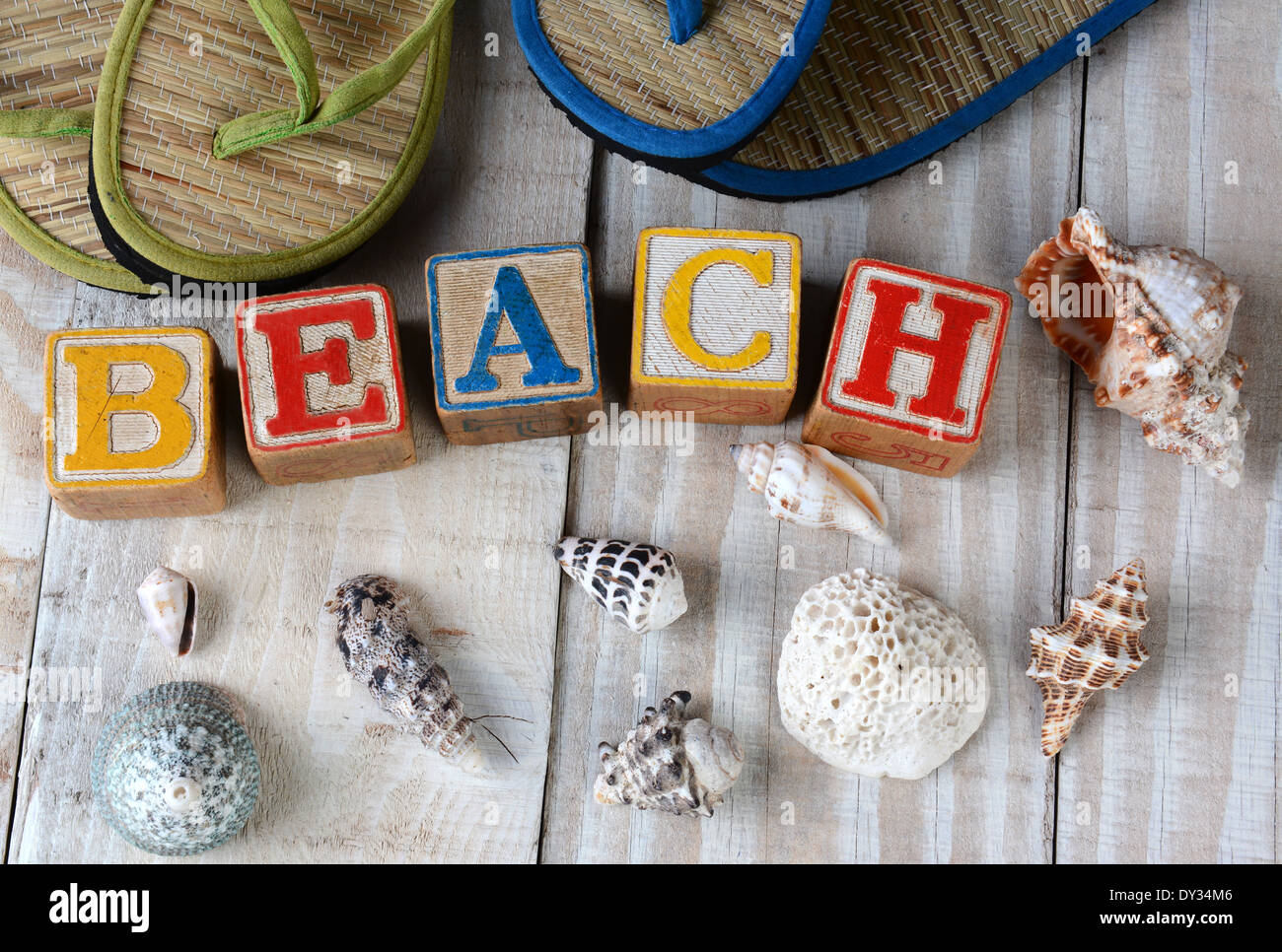 Childrens Blocks Spelling Out Beach on a rustic wooden boardwalk. The