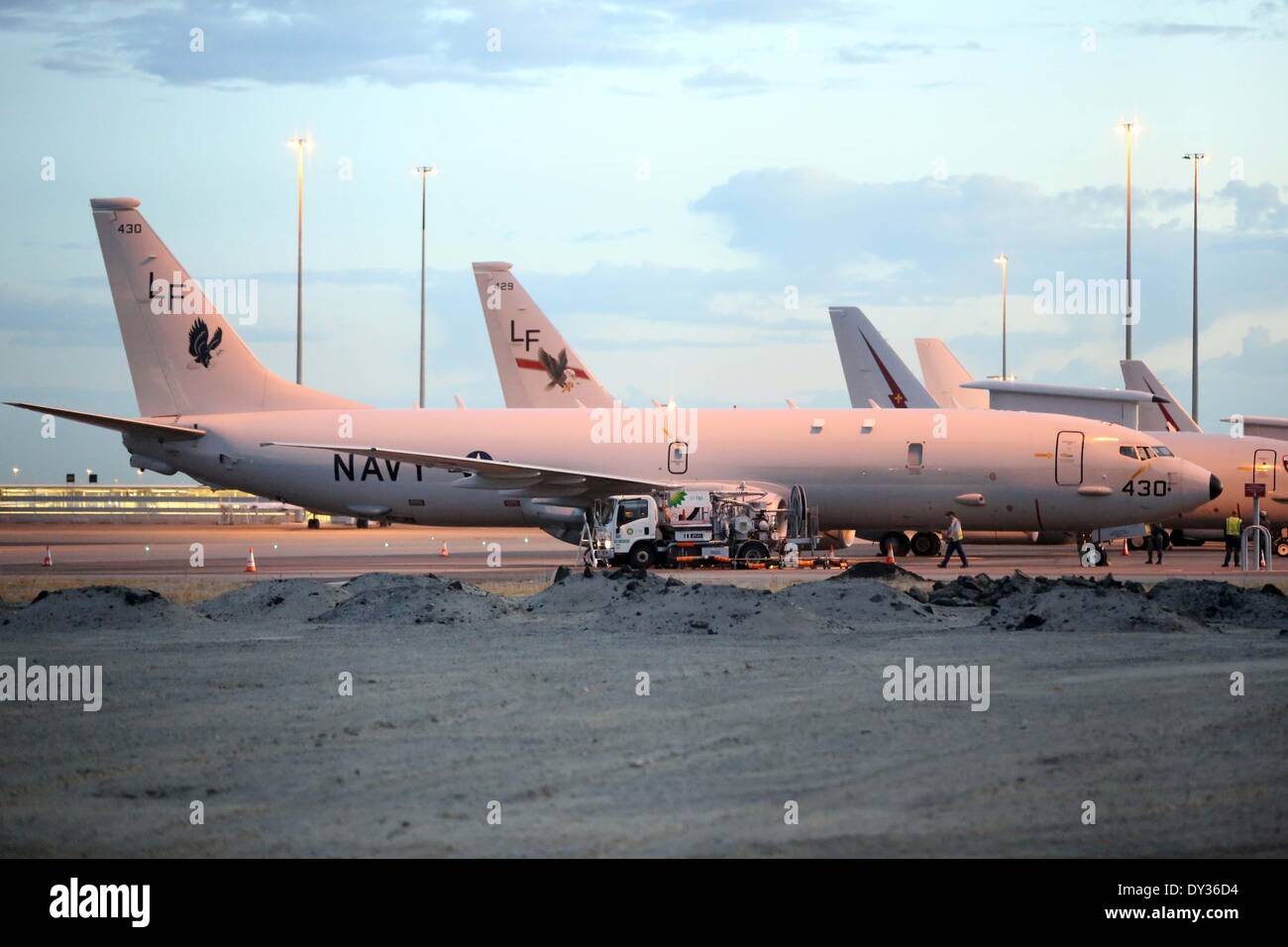 Perth. 5th Apr, 2014. Photo taken on April 5 shows two U.S. Navy plane P-8 Poseidon at Perth International Airport in Australia. U.S. 7th Fleet has sent two P-8 Poseidon patrol aircrafts to help in the search efforts for the missing Malaysia Airlines Flight MH370. © Xu Yanyan/Xinhua/Alamy Live News Stock Photo