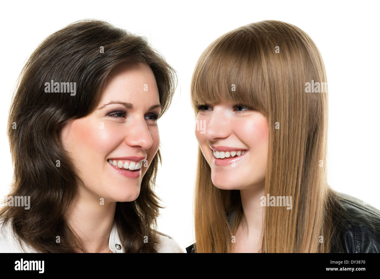 Portrait of two happy women, blond and brunette, isolated on white ...