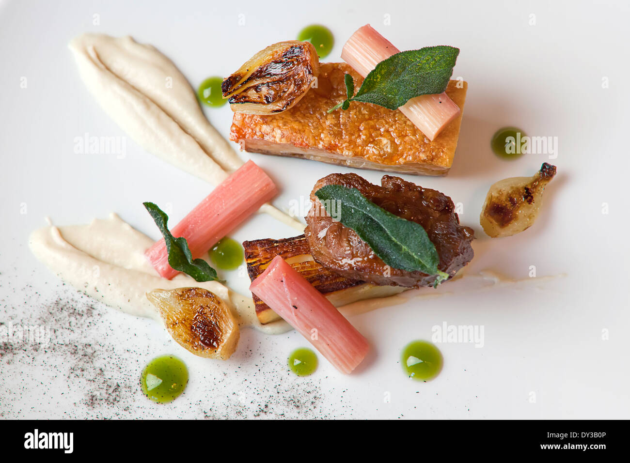 Pork cheek and belly pork served with dauphinoise potatoes and poached