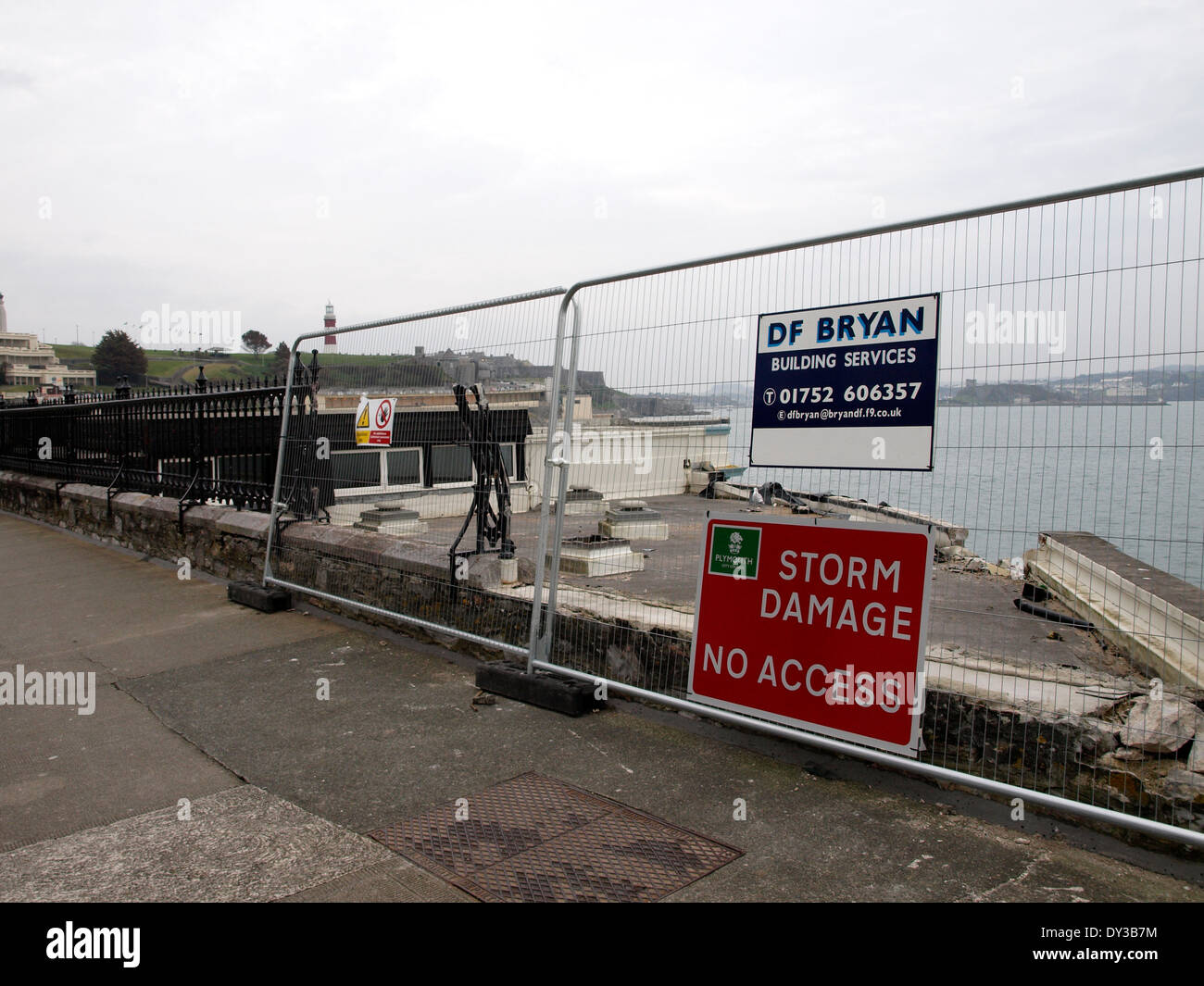 Fencing blocking the waterfront after storm damage, Plymouth, Devon, UK Stock Photo