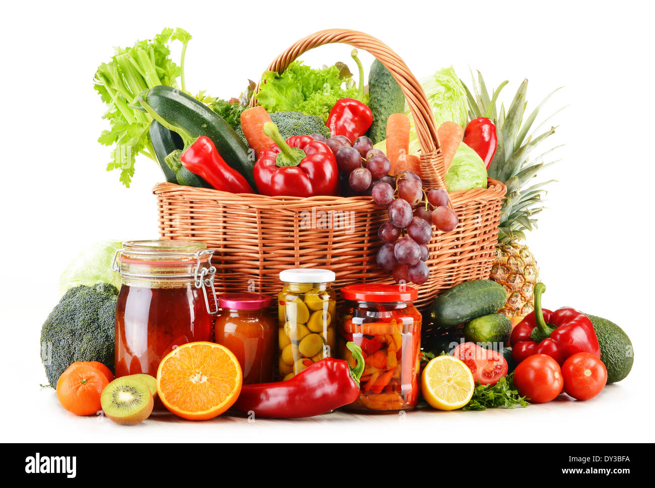 Wicker basket with groceries isolated on white background Stock Photo