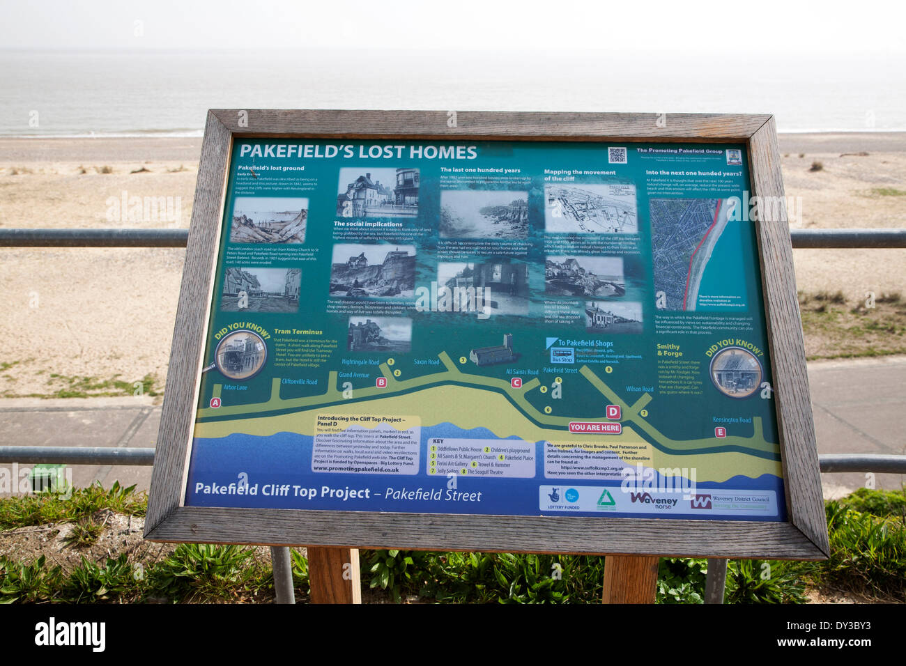 Information notice sign about lost homes due to coastal erosion view out to sea, Pakefield, Suffolk, England Stock Photo
