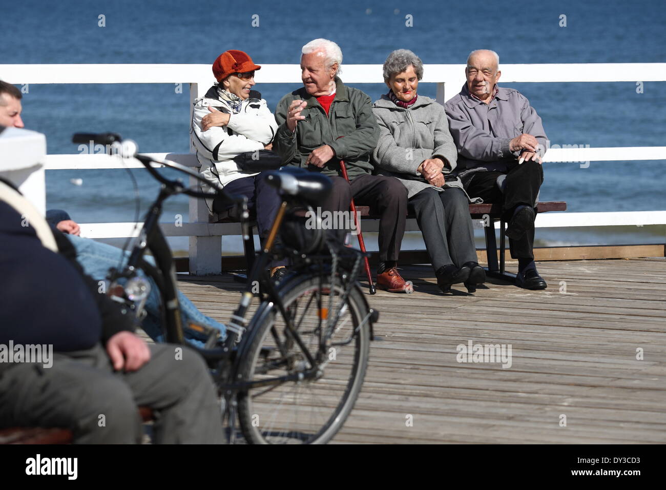 Gdansk, Poland 5th, April 2014 People enjoy sunny warm spring weather in Gdansk near the Brzezno pier. People walks, biking and skating. Pensioners sits on the bench at the Brzezno pier Credit:  Michal Fludra/Alamy Live News Stock Photo
