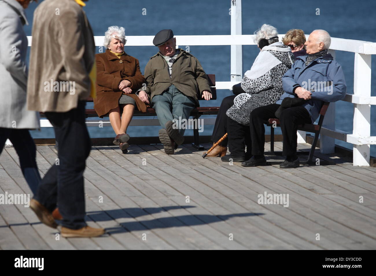 Gdansk, Poland 5th, April 2014 People enjoy sunny warm spring weather in Gdansk near the Brzezno pier. People walks, biking and skating. Eldery couple sit on the bench at the Brzezno pier Credit:  Michal Fludra/Alamy Live News Stock Photo