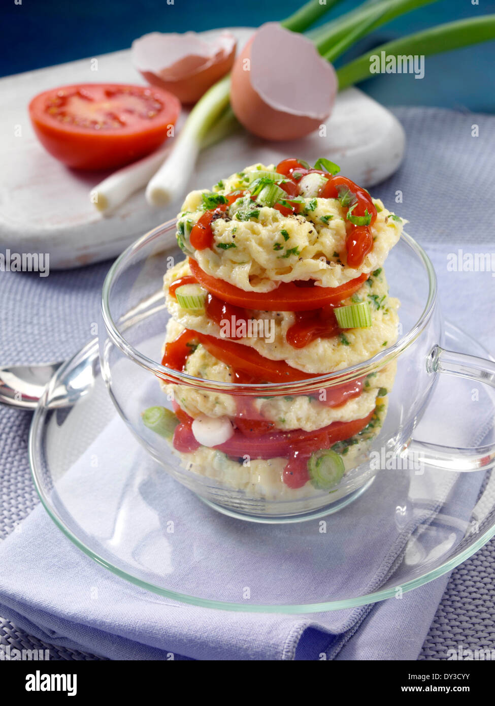 Herb omelette stack cooked in a glass cup individual portion Stock Photo