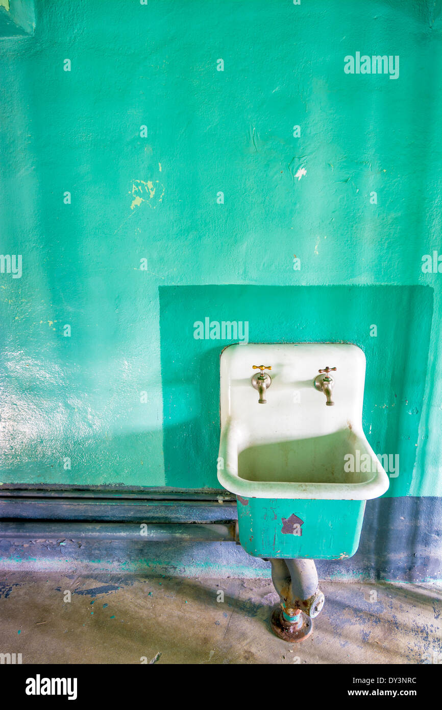 Antique sink in an abandoned building Stock Photo