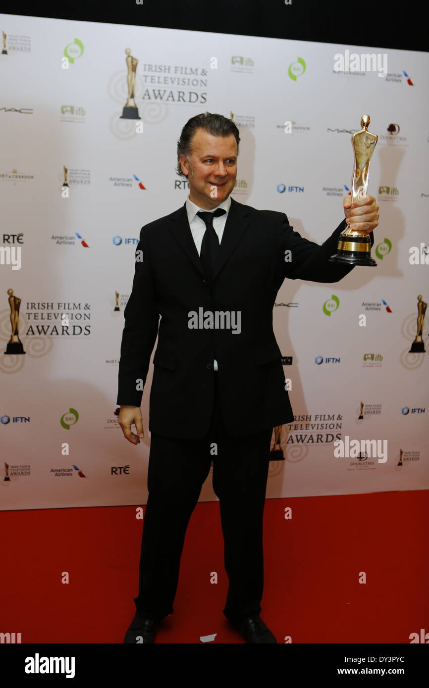 Dublin, Ireland. 5th April 2014. Irish director Ian Fitzgibbon presents his IFTA award for Best