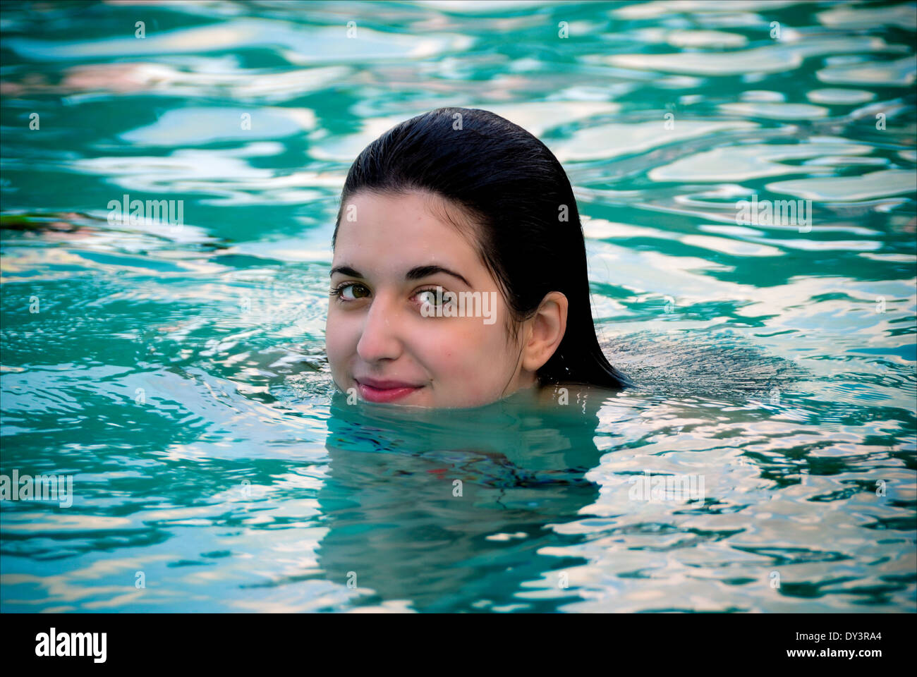 A pretty girl in a swimming pool. Stock Photo