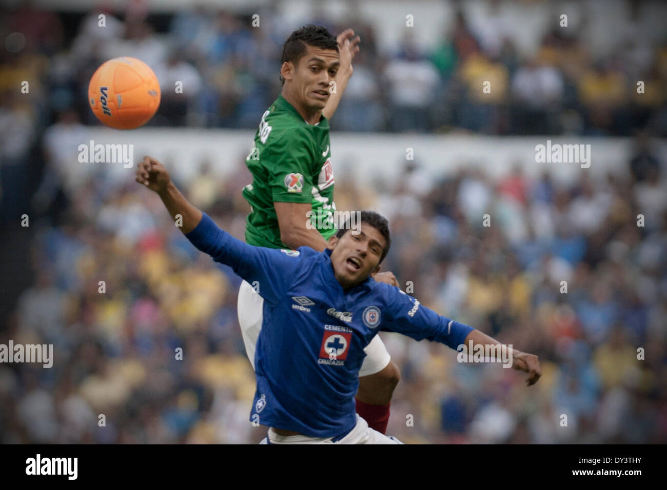 Mexico City, Mexico. 5th Apr, 2014. America's Andres Andrade (Rear) vies for the ball with Joao Rojas of Cruz Azul during the match of the Liga MX in the Azteca Stadium in Mexico City, capital of Mexico, on April 5, 2014. © Alejandro Ayala/Xinhua/Alamy Live News Stock Photo