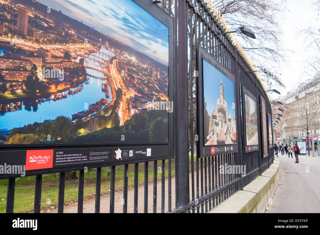 Photography exhibition '[Patrimoines L'Histoire en Mouvement]' on the iron railings of the Jardin du Luxembourg, Paris, France Stock Photo