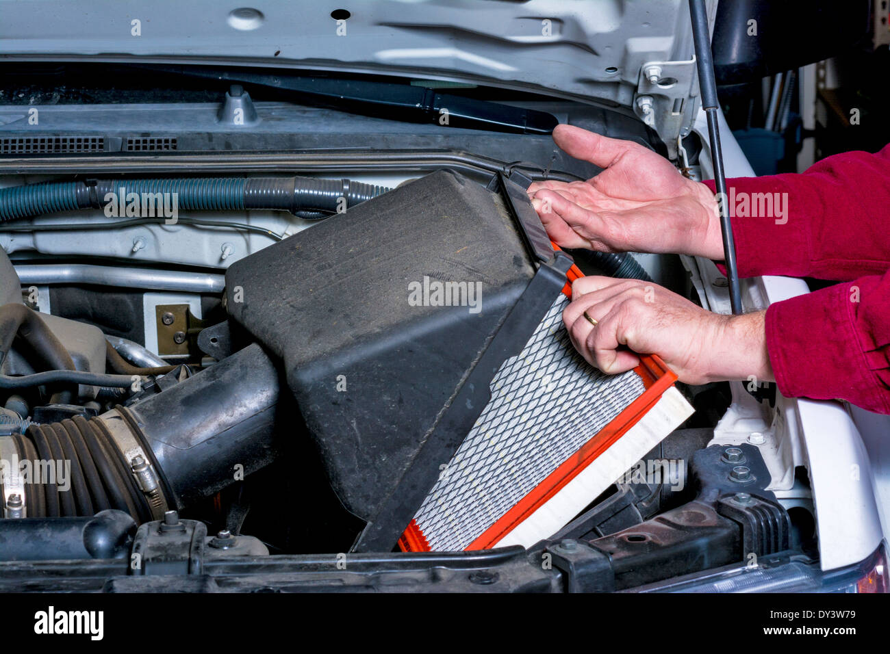 Replacing and air cleaner in a truck Stock Photo
