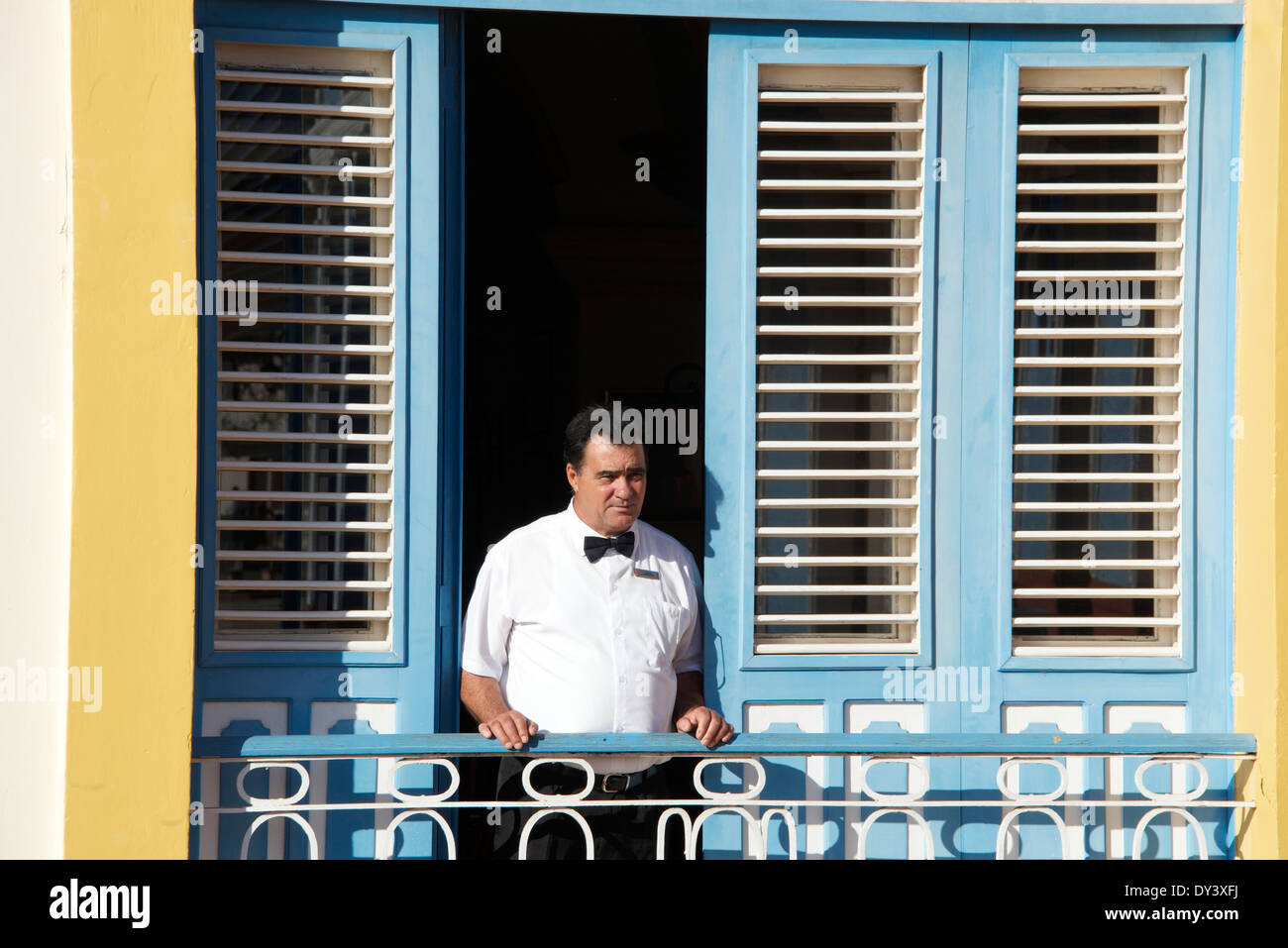 Waiter standing on balcony Hotel Mascotte Remedios Cuba Stock Photo