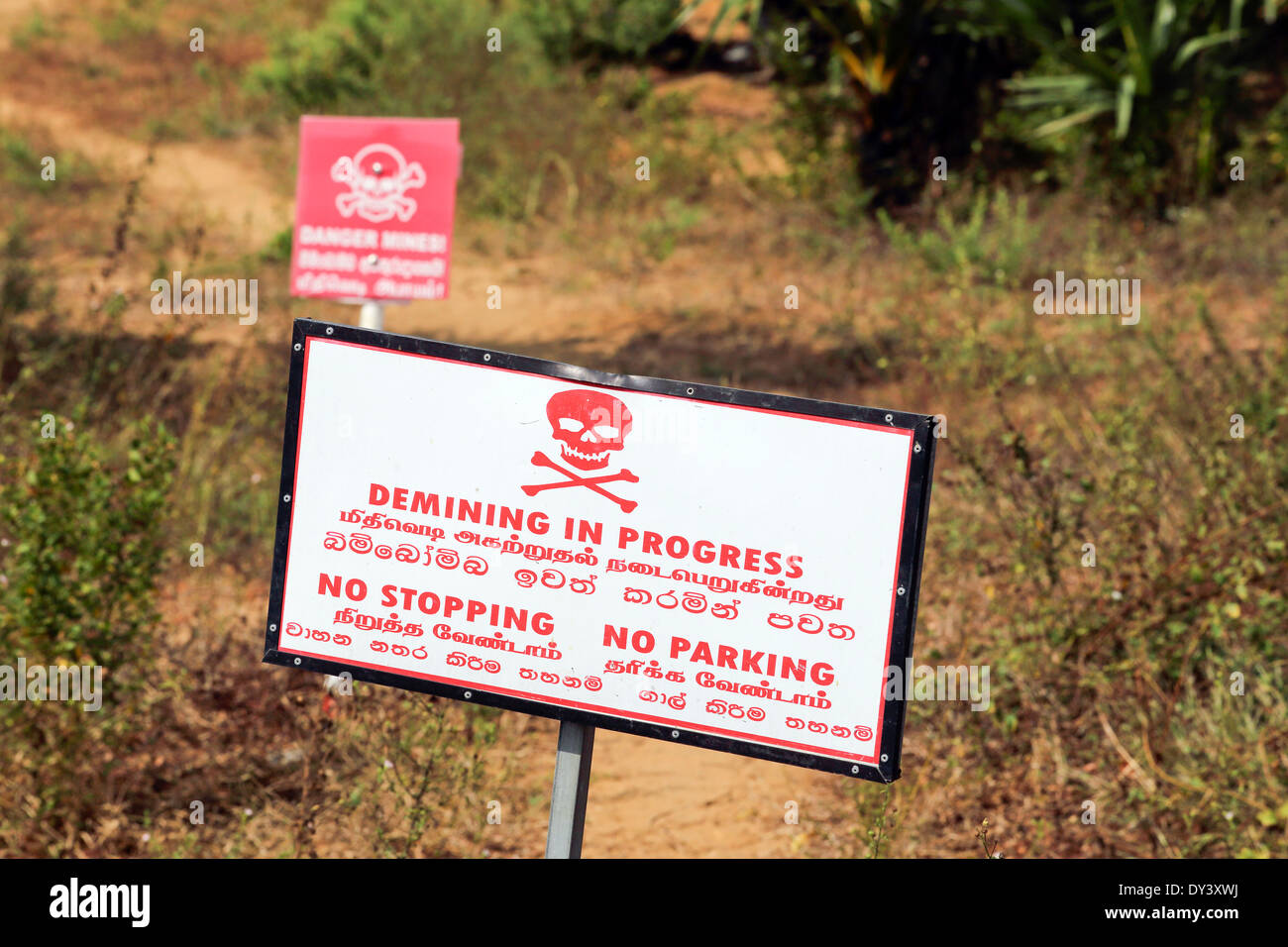 Land mine danger warning signs, demining in progress in former war torn Jaffna, Sri Lanka Stock Photo