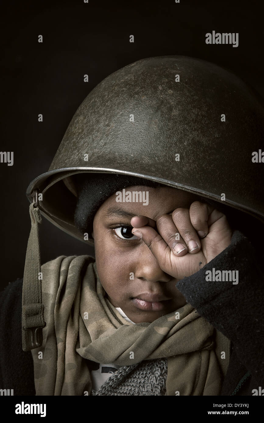 Boy soldier helmet hires stock photography and images Alamy