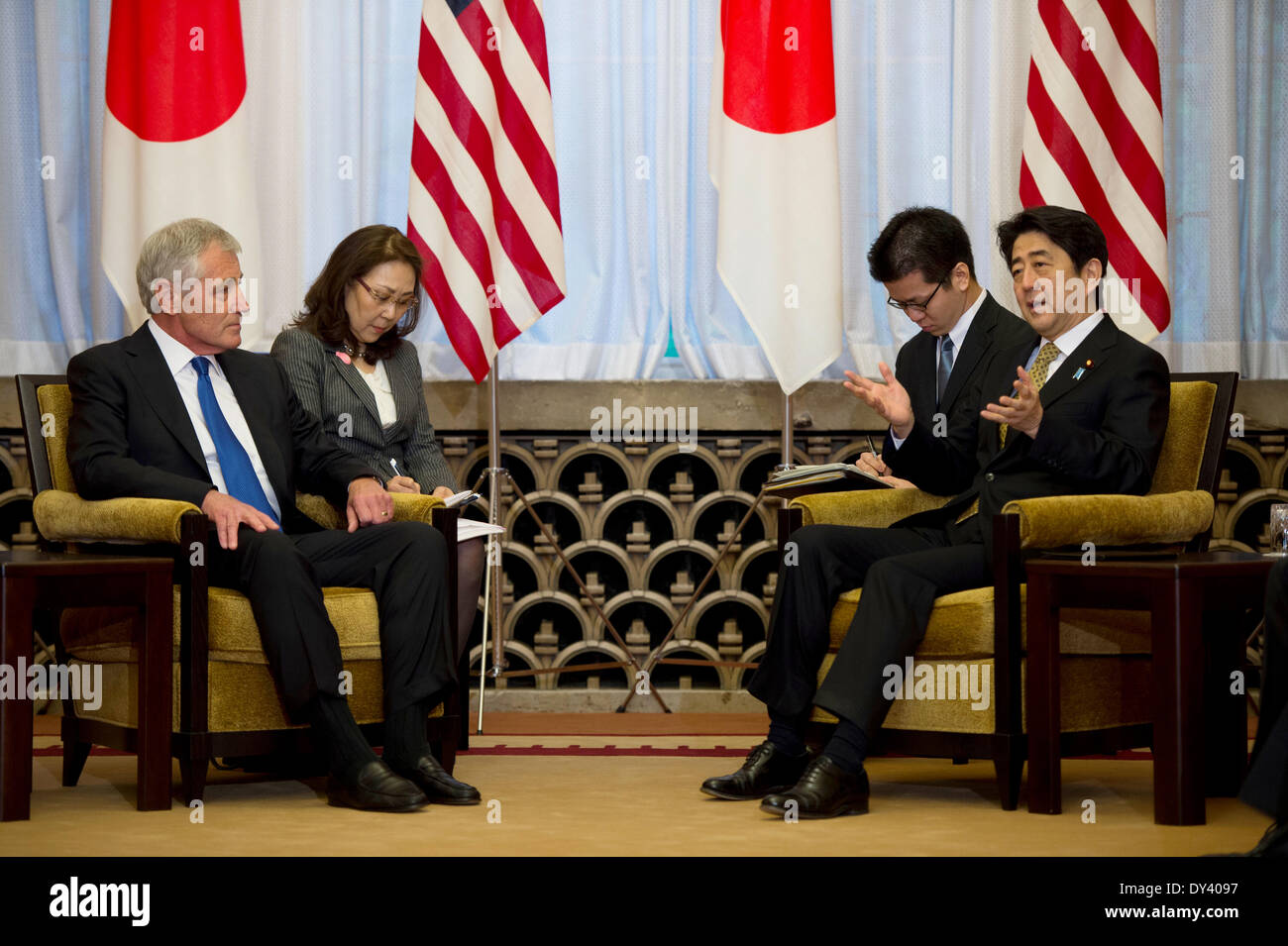 US Secretary of Defense Chuck Hagel meets with Japanese Prime Minister Shinzo Abe at the Prime Ministers official residence Sori Daijin Kantei April 5, 2014 in Tokyo, Japan. Hagel announced the deployment of drones and missile destroyers to bolster US-Japan defense alliance. Stock Photo